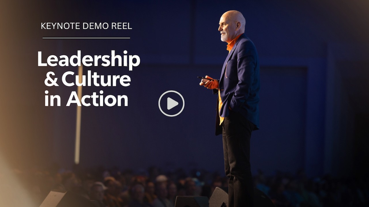 Chester Elton on stage delivering a keynote